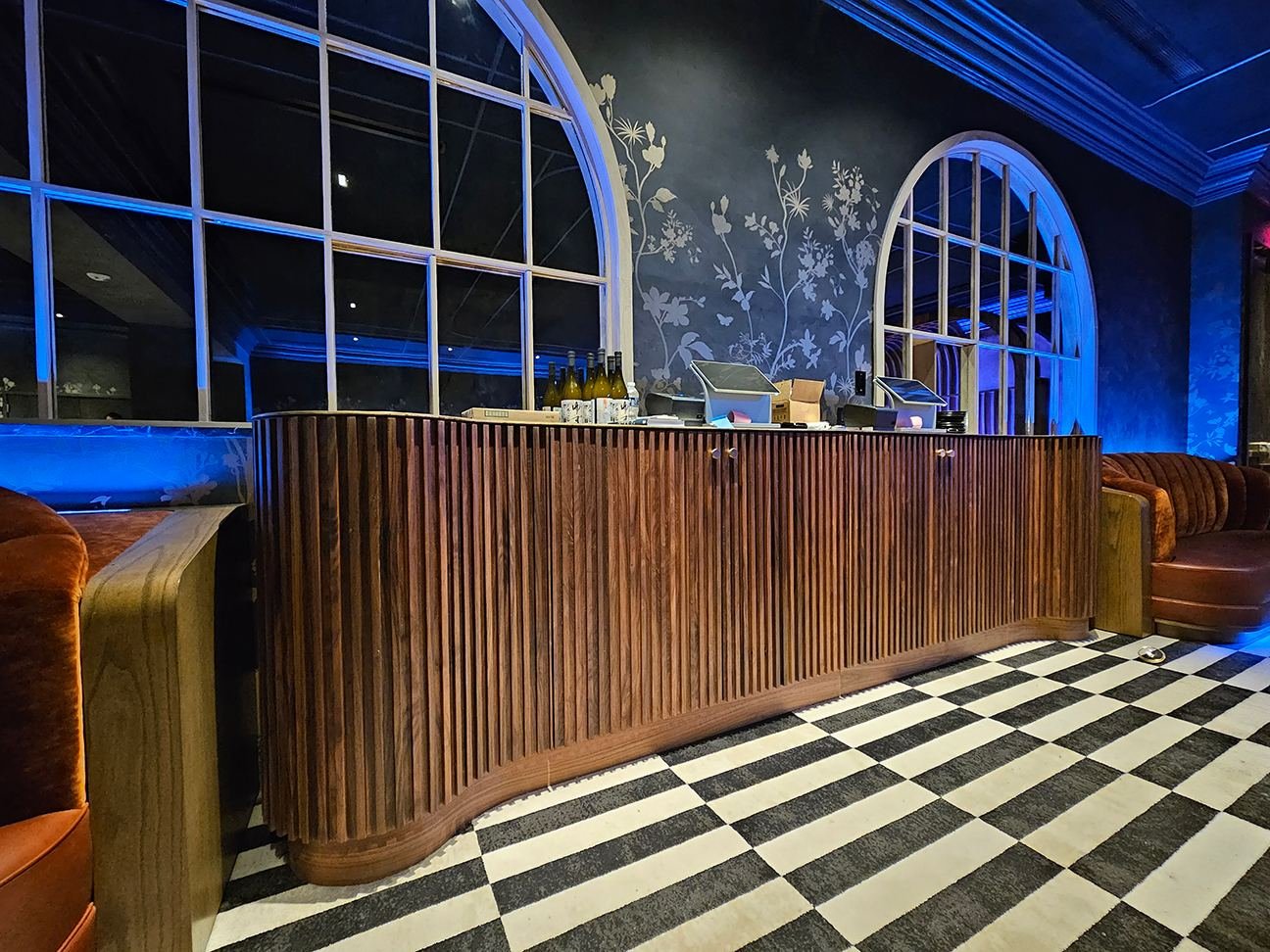 Music lounge server station — walnut tambour cabinetry with brass top